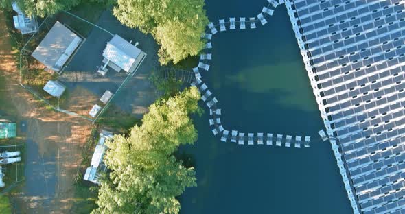 Aerial Top View of Renewable Energy Eco Technology Electric Power Industry Solar Panels on Floating alt