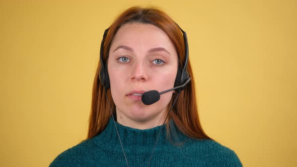 A Young Woman Talks or Teaches on a Video Call