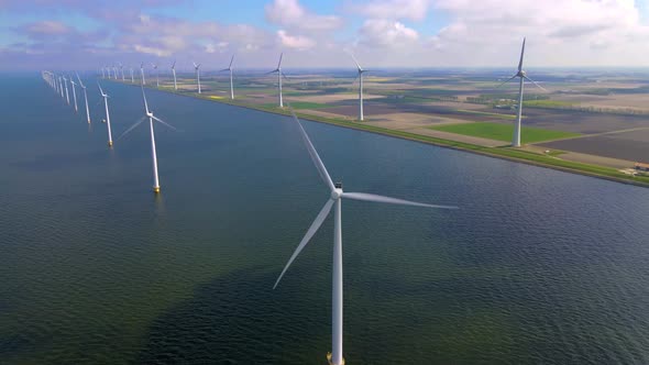 Wind Turbines in the Early Morning Wind Mill Park in the Netherlands alt