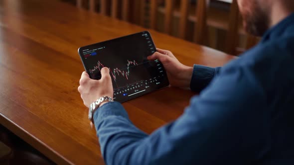 Businessman checking bitcoin price chart on digital exchange on mobile phone screen, cryptocurrency alt