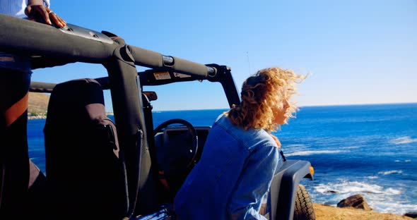 Group of Female Friends Toasting Beer Bottles in The Beach alt