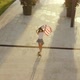 Young Active Caucasian Woman Rides Skateboard Holding American Flag Over Head - VideoHive Item for Sale