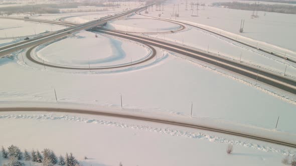 Interchange with a Road Bridge in Winter Aerial View alt