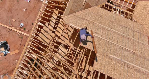 Home Roof Construction Applying Roof Plywood Panels in New House alt