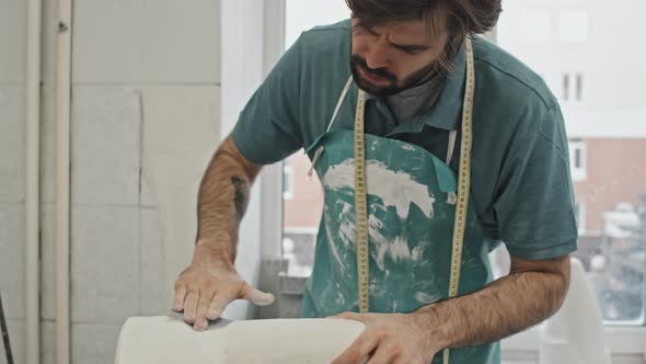 Man Polishing Plaster Cast alt