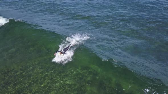 A View From Above of the Surfers in the Ocean