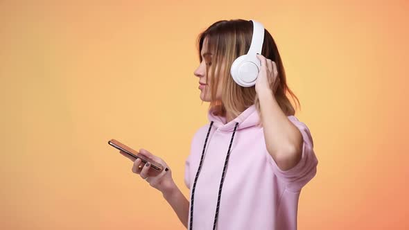 Blonde Woman Dance with Headphones
