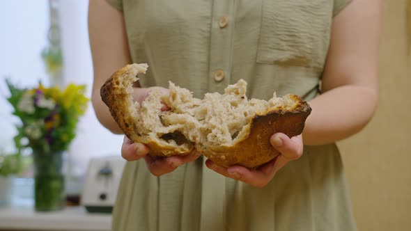 Commercial Shots a Girl Baked Bread She Cuts It with a Knife Breaks It with Her Hands Sniffs It It alt