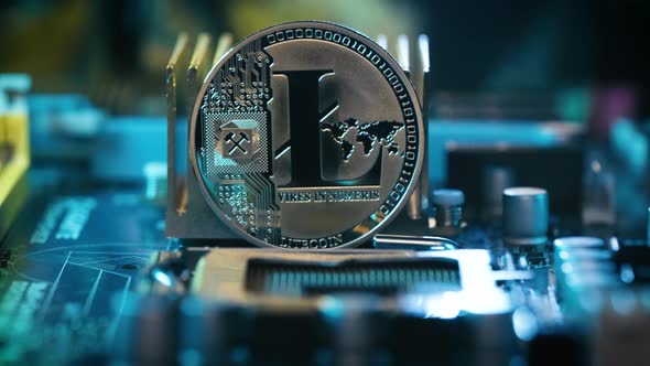 Silver Litecoin displayed on Computer motherboard, Trading and mining Crypto currency alt