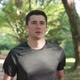 Adult Man Running in the City Park Using Bluetooth Earphones and Smart Watch App Enjoying Healthy  - VideoHive Item for Sale