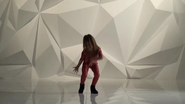 Baby Raises Her Leg Up in Studio, Geometrical Abstract Background alt