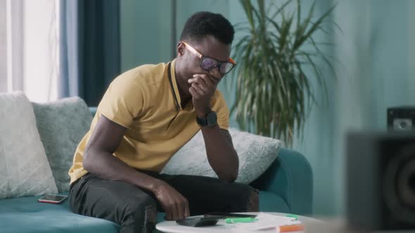 Upset Black Guy Checking Bills alt