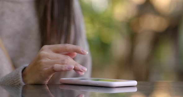Close up of woman use of mobile phone at outdoor alt