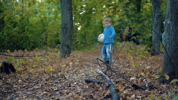 Little Boy is Trying to Tear a Big Branch 2 alt