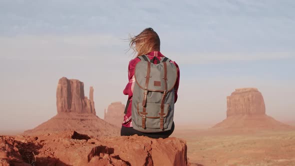 Woman Lifting Arms Up Feeling Freedom and Happiness in Monument Valley  Travel alt