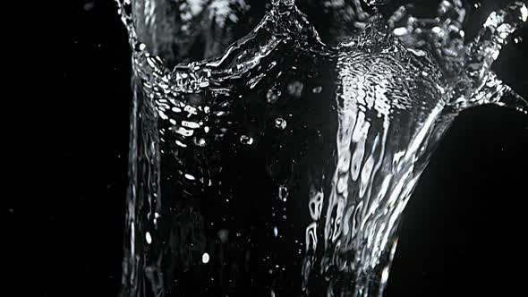 Water spurting out against Black Background, Slow motion alt