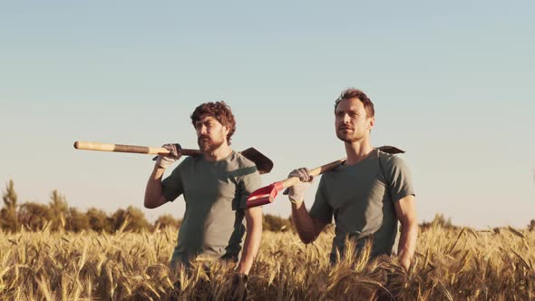 Two Handsome Farmers in Wheat Field at Sunset alt