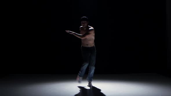 Breakdance Dancer Man In Cap With Naked Torso Dance Black Shadow Stock Footage