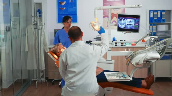 Elderly Woman During the Medical Dental Examination alt