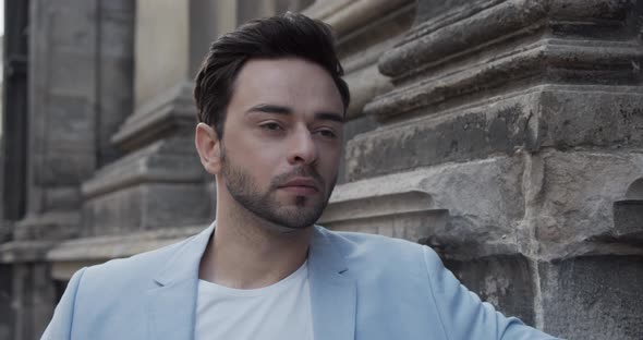 The Guy Is Waiting For A Meeting Near The Old Palace alt