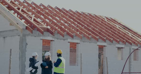 Female Engineer Explaining While Discussing with Coworkers alt