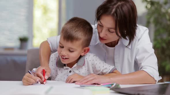 Mother with Son Drawing at Home