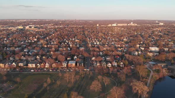Aerial footage neighborhood horizon during golden hour alt