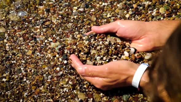 The Man Collects Stones at the Sea, Stock Footage | VideoHive