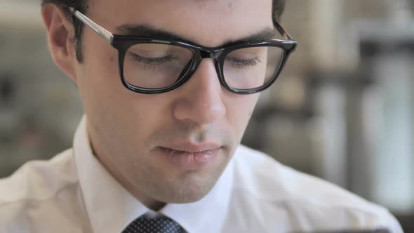 Businessman Scrolling Smartphone alt