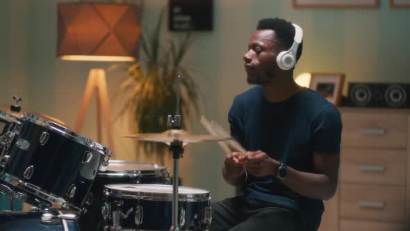 African American Drummer Rehearsing in Evening alt
