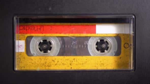 Audio Tape. Vintage Tape Recorder Plays Audio Cassette Inserted Therein alt