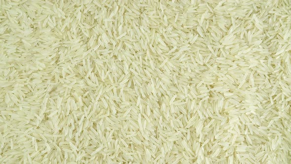 Rotating Grains Of Raw Rice Close Up.