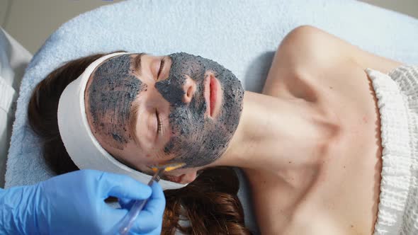 Girl with Closed Eyes Lying on the Massage Bed