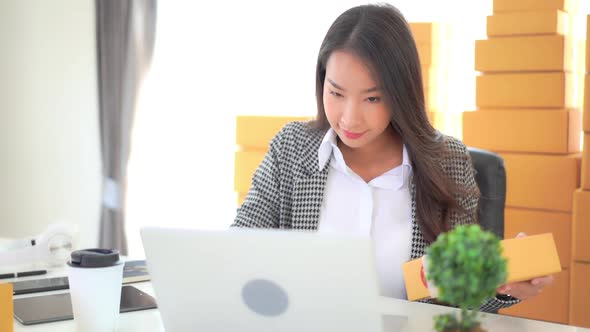 Young asian woman use laptop