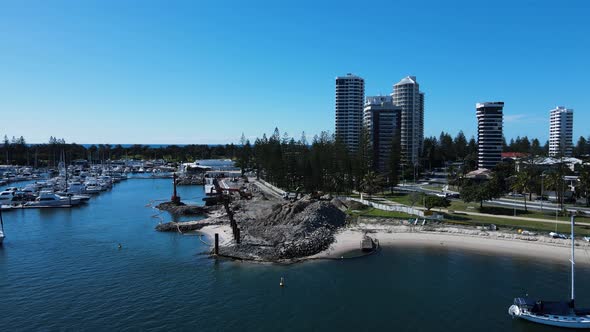 Revealing drone view of a government infrastructure project in a boating marina and harbor next to a alt