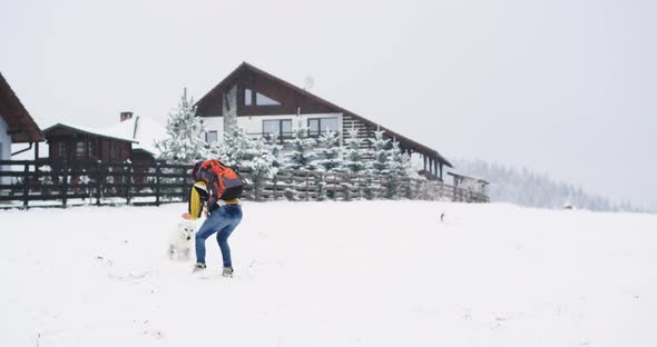 In Hard Winter Day with Snow Tourist Man Playing alt