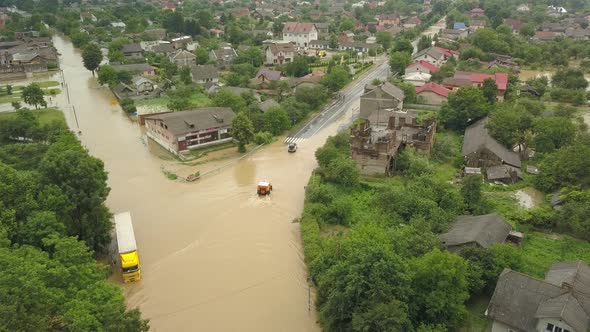 Special Vehicles Are Moving on the Flooded Road After the Flood. Flooded City of Halych Aerial View