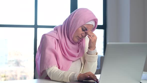 Muslim Woman Wearing Hijab Using Laptop at Office alt