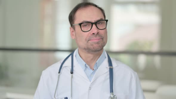 Middle Aged Doctor Showing No Sign By Head Shake alt