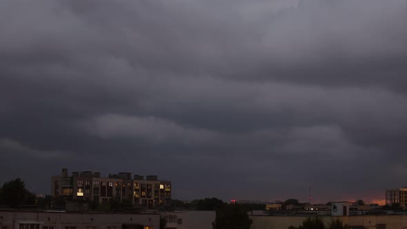 Timelapse of storm clouds over city