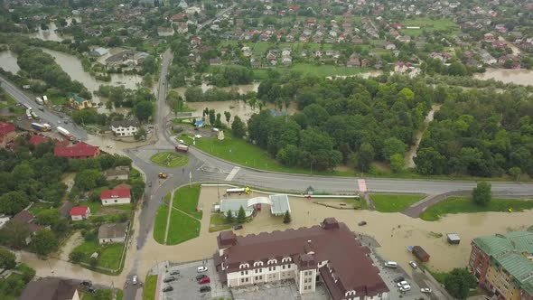 Top View of Flooded Intersection and Gas Station. The City During a Large-scale Flood. Aerial View