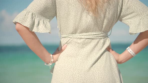 Girl Walking On Tropical Beah. Woman In Hat On Vacation. Woman On Summer Beach Near Ocean. alt