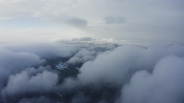 Aerial view of Cloudscape above Mountain in Winter, Flying through the Cloud alt