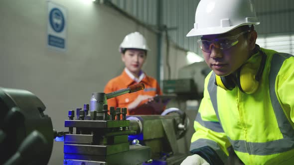 professional asian male engineer specialist worker wearing uniform hand control