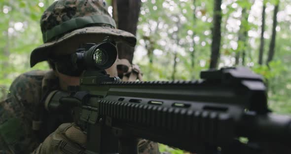 Fully Equipped Rifle Soldier Wearing Camouflage Uniform Attacking Enemy Rifle in Firing Position in alt