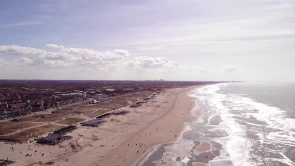 Aerial View Along Sea Waves Along Katwijk aan Zee Beach Coastline In South Holland On Bright Sunny D alt
