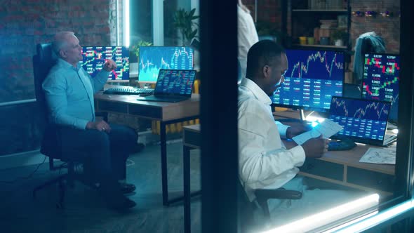 A Group of Stockbrokers are Analyzing the Data alt