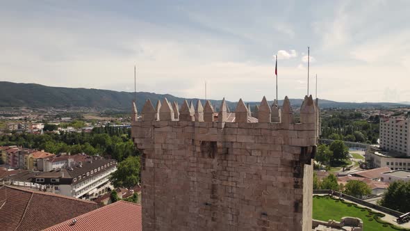 Aerial parallax of medieval Tower of Chaves Castle, cityscape as Background alt