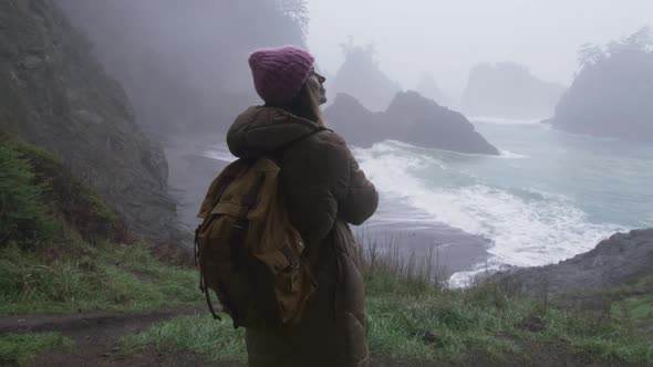 Woman Tourist Enjoying Rainy Weather on Cloudy Day in Green Forest 6K RED Shot alt