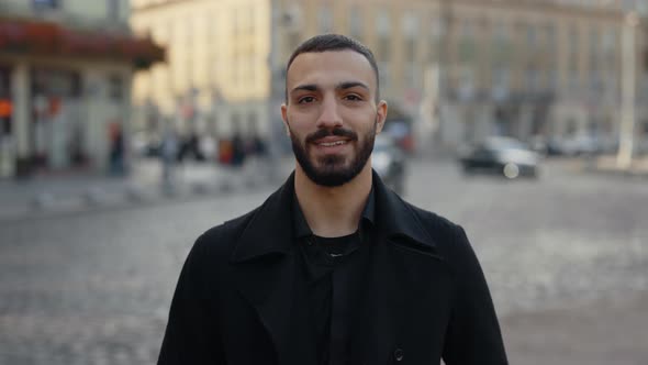 Arabian Man in Formal Wear Smiling on Camera Outdoors alt